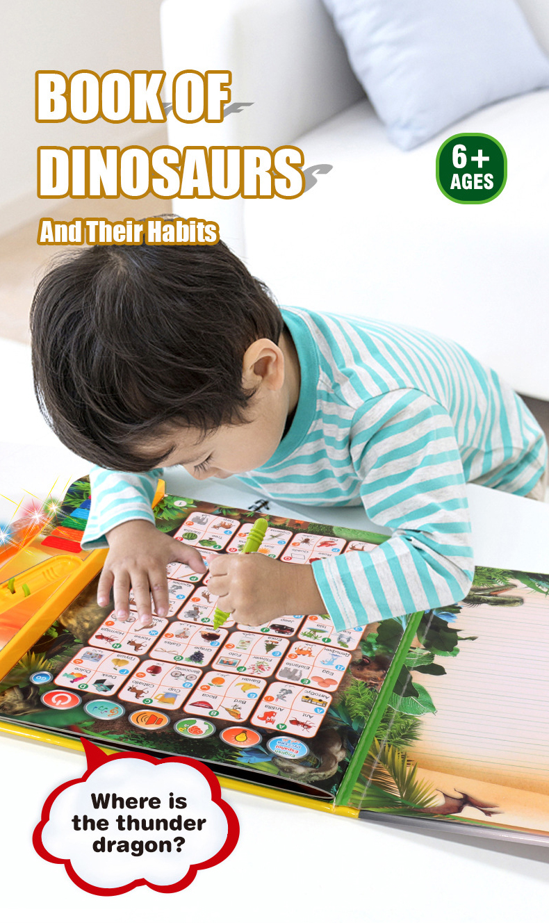 The little boy in the striped shirt was leaning over the e-book, pen in hand, pointing to find where the thunder dragon was