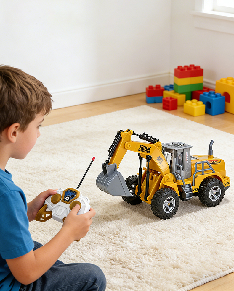 A little boy sits in the room playing with a remote control engineering truck