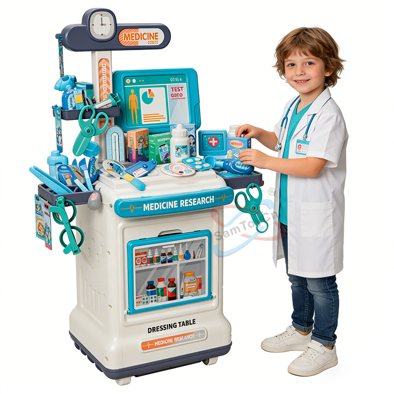 A little boy dressed as a doctor is smiling while playing with the Play House Medical Cart Set toy