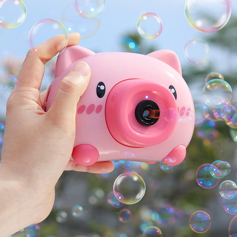 Using the pink pig bubble machine toy outdoors in the sunshine