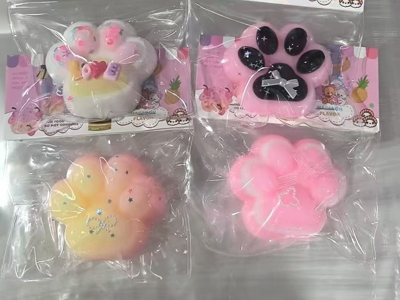 Pinching Fun: Multicolored Cat Paws