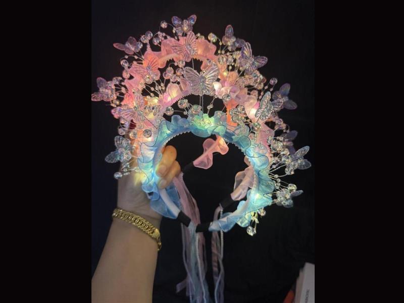 A Flower-Adorned Butterfly Hairband With Lights